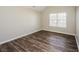 Cozy bedroom with hardwood floors and a bright window at 3641 Oakleaf Pass, Fairburn, GA 30213