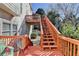 View of the outdoor deck with wooden stairs leading to a second-story balcony at 1301 Dayspring Trce, Lawrenceville, GA 30045