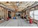 Unfinished basement area with exposed ceiling and some storage at 1301 Dayspring Trce, Lawrenceville, GA 30045