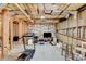Unfinished basement with treadmill, tv, and some storage at 1301 Dayspring Trce, Lawrenceville, GA 30045