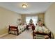 Cozy bedroom with twin beds, a vanity, soft lighting, and space for relaxation at 1301 Dayspring Trce, Lawrenceville, GA 30045