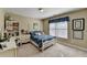 Bedroom featuring a bed and desk with large window for natural light at 1301 Dayspring Trce, Lawrenceville, GA 30045