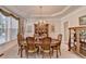 Formal dining room with traditional furniture and elegant chandelier at 1301 Dayspring Trce, Lawrenceville, GA 30045