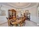 Formal dining room showcasing a chandelier, wood table with seating for six, and built-in cabinets at 1301 Dayspring Trce, Lawrenceville, GA 30045