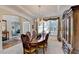 Traditional dining room with a chandelier, wood table, and a view of the entryway at 1301 Dayspring Trce, Lawrenceville, GA 30045