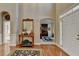 Elegant foyer with hardwood floors and a view into other living spaces at 1301 Dayspring Trce, Lawrenceville, GA 30045