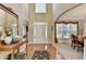 Grand foyer with soaring ceilings, hardwood floors, and arched doorways at 1301 Dayspring Trce, Lawrenceville, GA 30045
