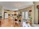 Sunlit kitchen featuring hardwood floors, light wood cabinetry, and access to the backyard at 1301 Dayspring Trce, Lawrenceville, GA 30045