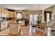 Spacious kitchen featuring a central island, stainless appliances, and a dining area at 1301 Dayspring Trce, Lawrenceville, GA 30045