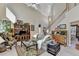 Bright living room with a high ceiling, a staircase, and comfortable seating at 1301 Dayspring Trce, Lawrenceville, GA 30045