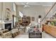 Inviting living room with a fireplace, cozy seating, and a staircase leading to the upper level at 1301 Dayspring Trce, Lawrenceville, GA 30045