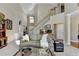 Bright living room featuring high ceilings and an open staircase with views to the home's entry at 1301 Dayspring Trce, Lawrenceville, GA 30045