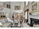 Spacious living room offering fireplace, plush seating, and seamless flow to the kitchen at 1301 Dayspring Trce, Lawrenceville, GA 30045
