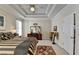 This bright main bedroom is complete with tray ceilings and stylish decor at 1301 Dayspring Trce, Lawrenceville, GA 30045