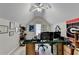 Spacious office with desk, shelving, a fan and a large window for natural light at 1301 Dayspring Trce, Lawrenceville, GA 30045