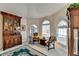 Cozy sitting area with vintage furniture and large windows at 1301 Dayspring Trce, Lawrenceville, GA 30045
