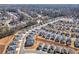 Aerial view of Sweetwater Estates with new homes and lush trees at 1761 Dosk Ave, Lawrenceville, GA 30044