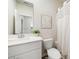 Clean bathroom with white cabinets and shower with curtain at 1761 Dosk Ave, Lawrenceville, GA 30044