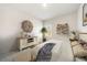 Well-lit bedroom features neutral decor, a queen bed and shelving at 1761 Dosk Ave, Lawrenceville, GA 30044