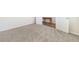 Bedroom with neutral carpet, bright white walls, and a view to the hall at 1761 Dosk Ave, Lawrenceville, GA 30044