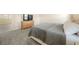 Serene bedroom with plush carpet, neutral walls, and an entertainment center with mounted TV at 1761 Dosk Ave, Lawrenceville, GA 30044