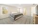Relaxing bedroom with plush carpet, natural light, and a comfortable bed for a peaceful retreat at 1761 Dosk Ave, Lawrenceville, GA 30044