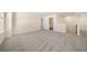 Spacious bonus room featuring neutral carpeting and a bright, airy atmosphere with access to a laundry room at 1761 Dosk Ave, Lawrenceville, GA 30044