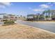 Welcome to Sweetwater Estates; community entrance with lush landscaping at 1761 Dosk Ave, Lawrenceville, GA 30044