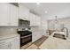 Contemporary kitchen with stainless steel appliances, granite countertops, and stylish backsplash at 1761 Dosk Ave, Lawrenceville, GA 30044