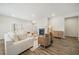 Spacious living room featuring a cozy fireplace, stylish furnishings, and wood flooring for a comfortable ambiance at 1761 Dosk Ave, Lawrenceville, GA 30044