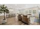 Open concept living room featuring hardwood flooring and an abundance of natural light at 1761 Dosk Ave, Lawrenceville, GA 30044