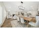 Open-concept living space with a modern kitchen, cozy living room, and dining area, perfect for entertaining guests at 1761 Dosk Ave, Lawrenceville, GA 30044