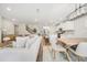 Bright and airy living space featuring a modern kitchen, spacious dining area, and cozy living room, ideal for Gathering gatherings at 1761 Dosk Ave, Lawrenceville, GA 30044