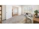 Well-lit office space with modern furniture, a work desk, and a view to a hallway with wood flooring at 1761 Dosk Ave, Lawrenceville, GA 30044
