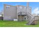 Fenced in backyard with a second story deck and stairs at 603 Stonecrest Dr, Loganville, GA 30052