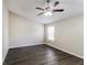Bright bedroom with modern flooring, neutral walls, and a window offering natural light at 603 Stonecrest Dr, Loganville, GA 30052