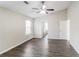 This main bedroom has wood floors, a ceiling fan, and lots of space at 603 Stonecrest Dr, Loganville, GA 30052