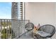Relaxing balcony space with seating and views of the city skyline at 860 Peachtree Ne St # 2001, Atlanta, GA 30308