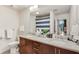 Bathroom with granite countertops, double sinks, and a shower at 860 Peachtree Ne St # 2001, Atlanta, GA 30308