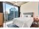 Bedroom with large windows offering amazing city views at 860 Peachtree Ne St # 2001, Atlanta, GA 30308