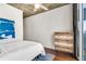Bedroom with hardwood floors, overhead ceiling fan, and accent painting displayed over bed at 860 Peachtree Ne St # 2001, Atlanta, GA 30308