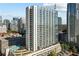 High-rise condominium featuring a modern facade, balconies, and city views at 860 Peachtree Ne St # 2001, Atlanta, GA 30308