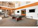 Spacious game room features a pool table, spiral staircase, fireplace, and flatscreen televisions at 860 Peachtree Ne St # 2001, Atlanta, GA 30308