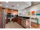 Modern kitchen with stainless steel appliances, black backsplash, and ample cabinet space at 860 Peachtree Ne St # 2001, Atlanta, GA 30308
