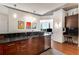 Kitchen with stainless steel appliances, granite counters, and an adjacent seating area at 860 Peachtree Ne St # 2001, Atlanta, GA 30308