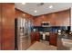 Bright kitchen with stainless steel appliances, dark cabinets, black backsplash and modern appliances at 860 Peachtree Ne St # 2001, Atlanta, GA 30308
