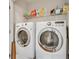 Laundry room with washer and dryer units, plus shelving above for storage at 860 Peachtree Ne St # 2001, Atlanta, GA 30308