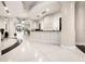 Lobby with a modern reception desk, stylish flooring, and elegant lighting at 860 Peachtree Ne St # 2001, Atlanta, GA 30308