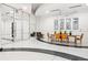 Elegant lobby showcasing a dining table with chairs, artwork, and a glass-enclosed entrance at 860 Peachtree Ne St # 2001, Atlanta, GA 30308