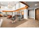 Brightly lit resident lounge with modern furnishings, fireplace, and beautiful chandelier lighting at 860 Peachtree Ne St # 2001, Atlanta, GA 30308